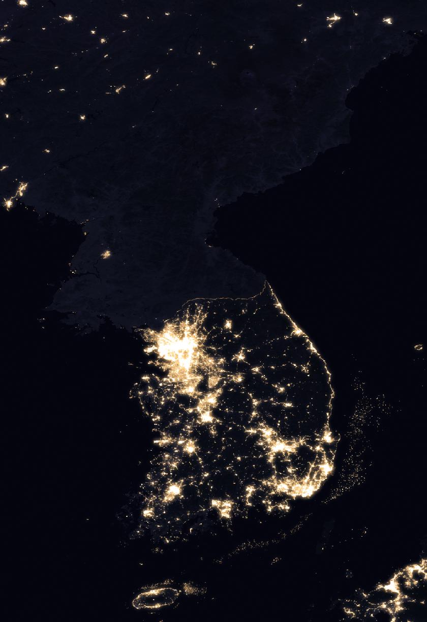 The peninsula at night. North Korea is the dark half.